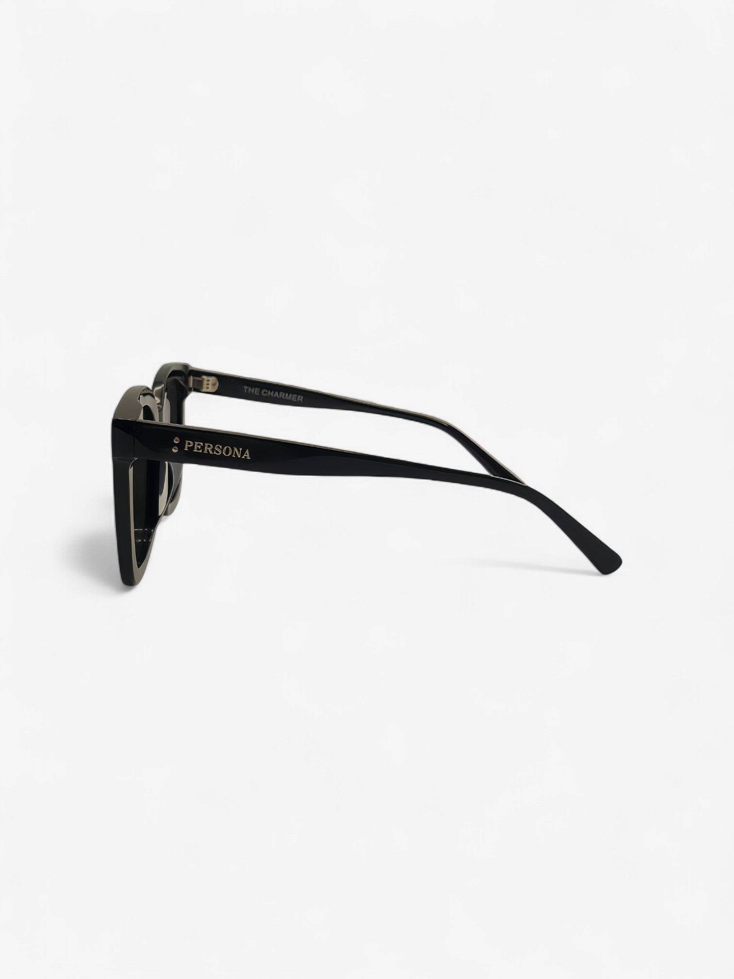 Side profile of Charmer sunglasses - black oversized frame