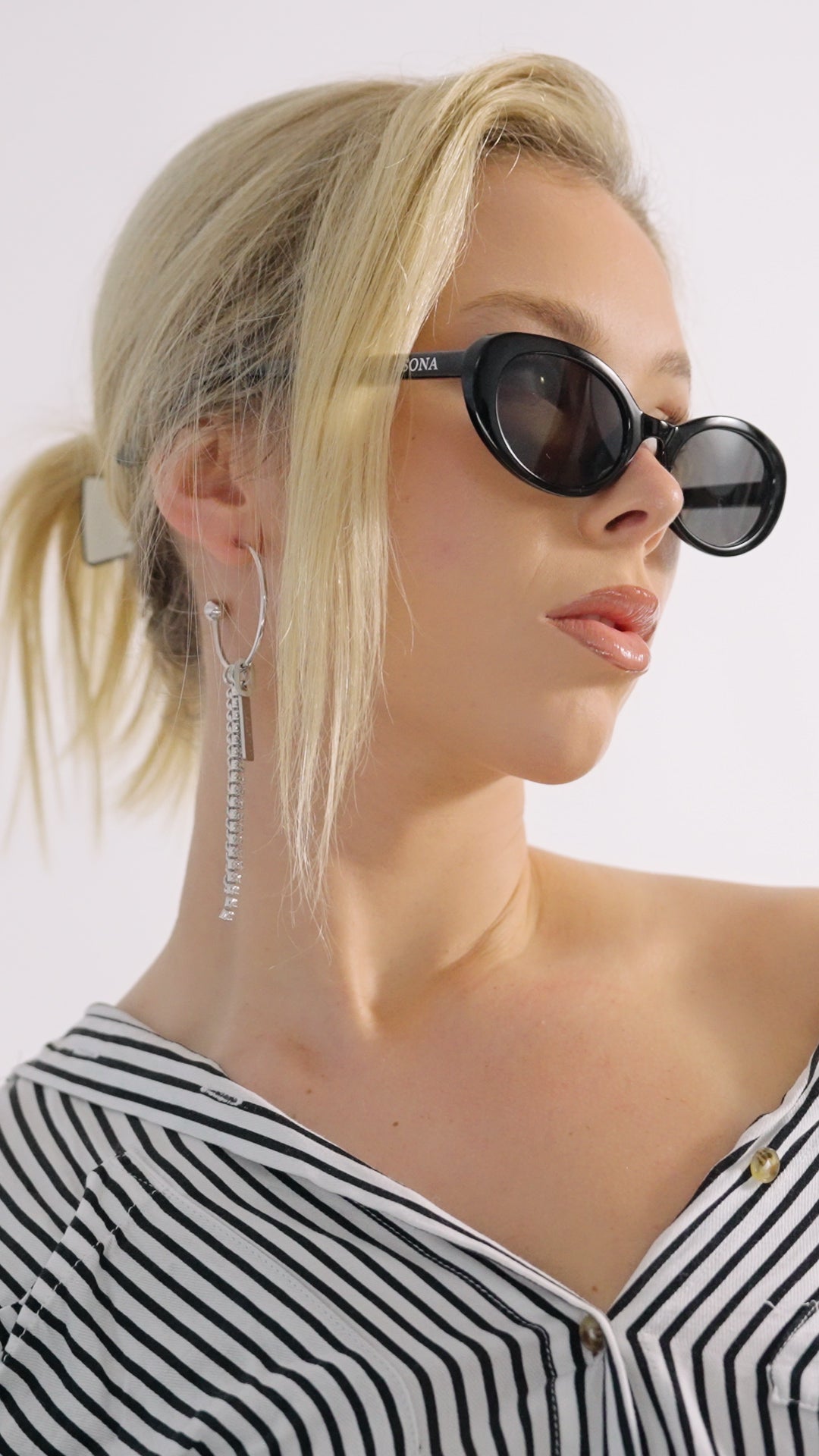 Side view of fashionable woman in Social Butterfly sunglasses - vintage-inspired frames 