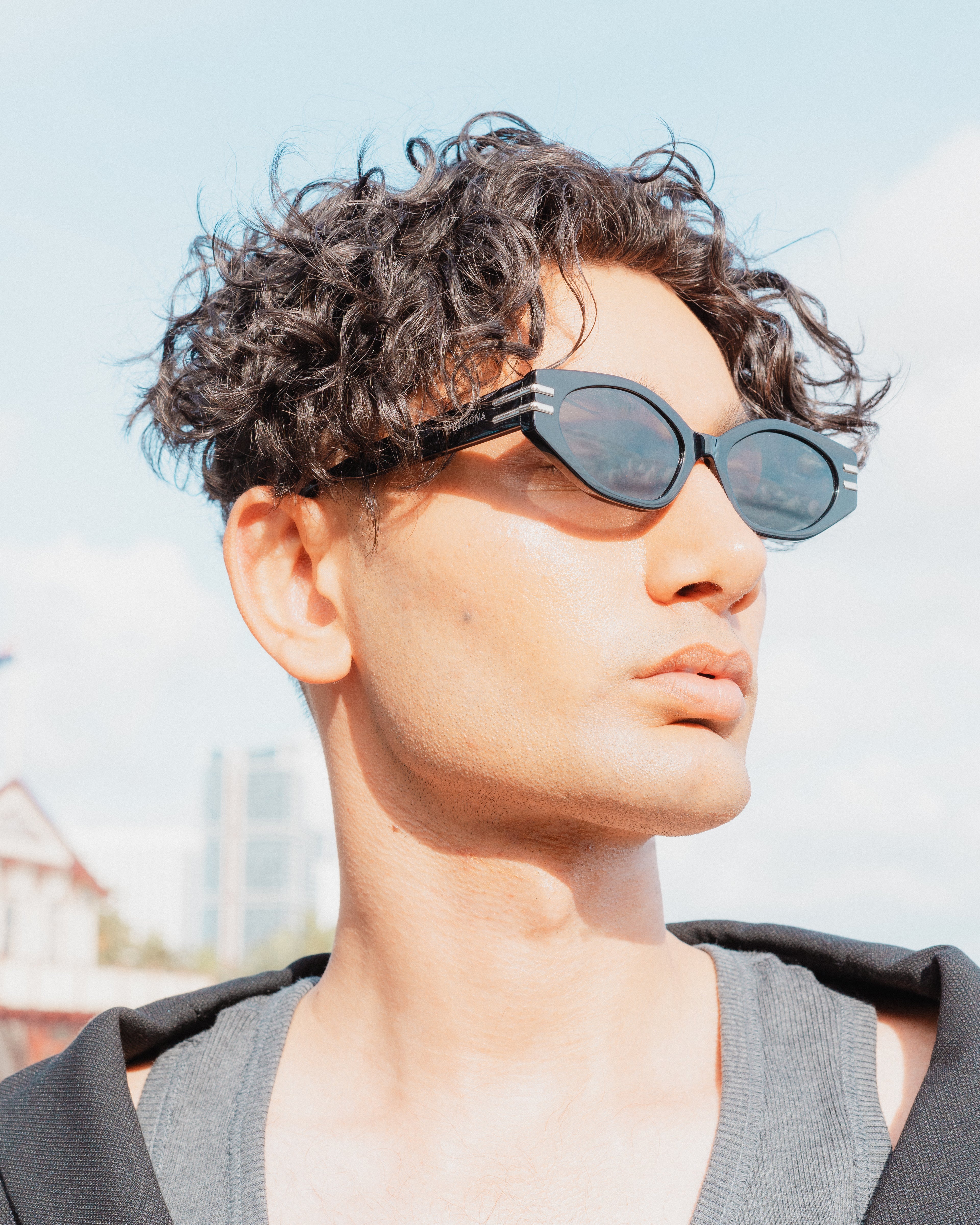 Fashion-forward man wearing The Rebel sunglasses - UV protected 